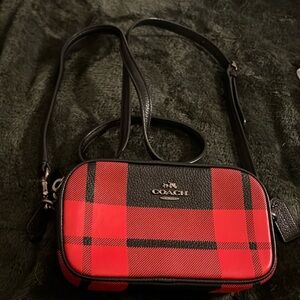 Small Buffalo Plaid Coach crossbody bag.